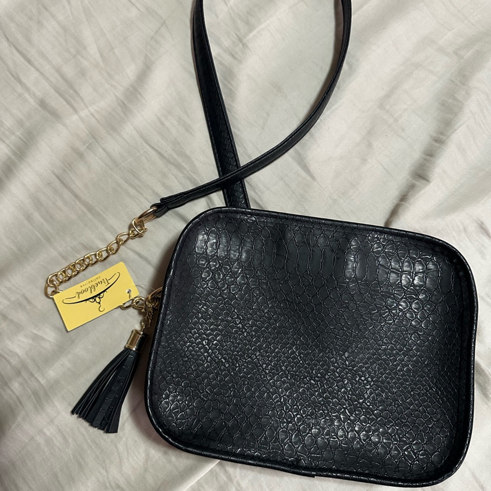 Snake print cross body clutch